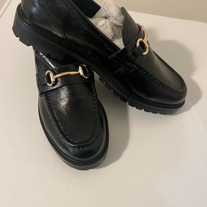 A chunky lugged everyday lugged loafer with shiny bit
